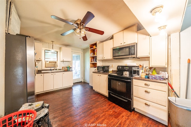 kitchen featuring ceiling fan, white cabinets, appliances with stainless steel finishes, and dark hardwood / wood-style flooring