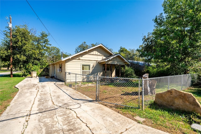 bungalow-style house with a front lawn