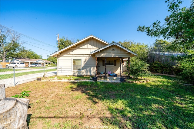 bungalow-style house with a front yard