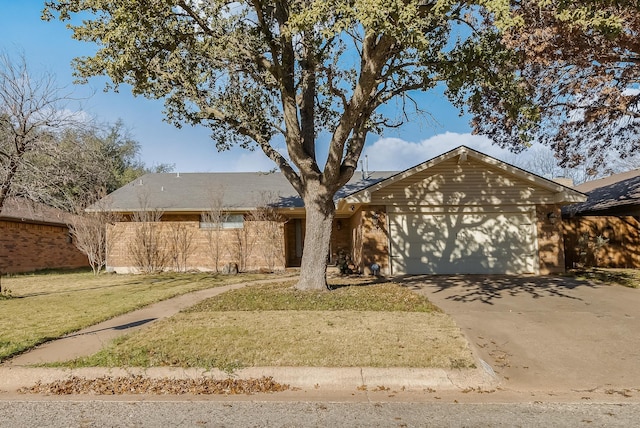 single story home featuring a front yard and a garage