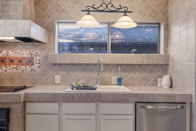 kitchen with dishwasher, black electric stovetop, sink, hanging light fixtures, and white cabinetry