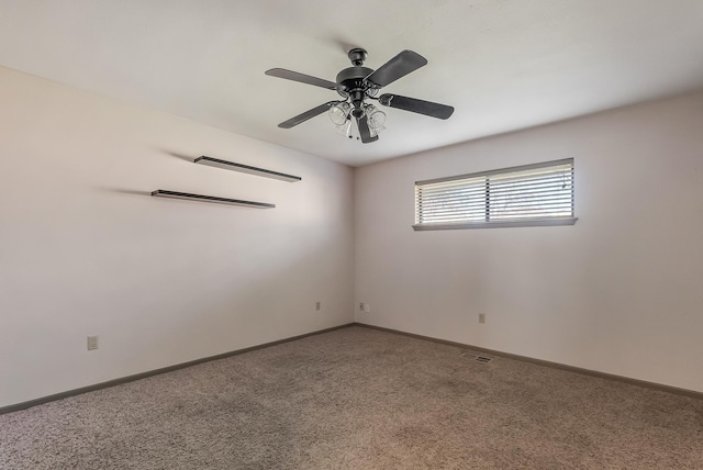 unfurnished room featuring carpet and ceiling fan