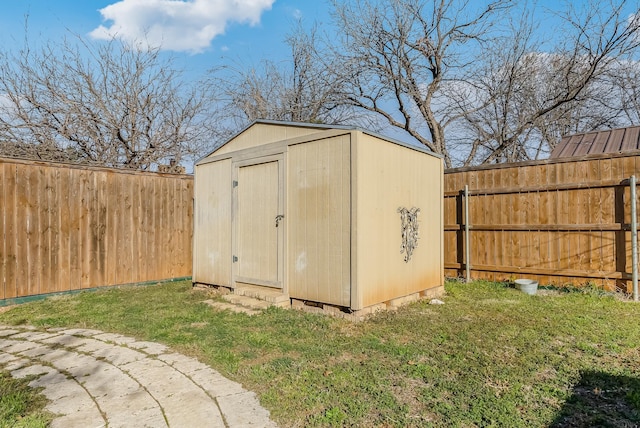 view of outdoor structure featuring a lawn