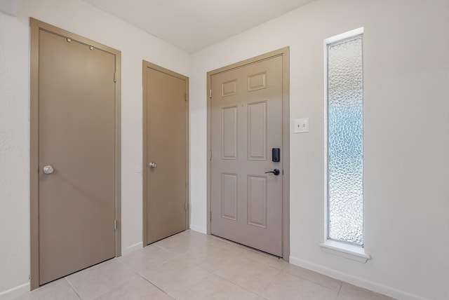 foyer with light tile patterned floors