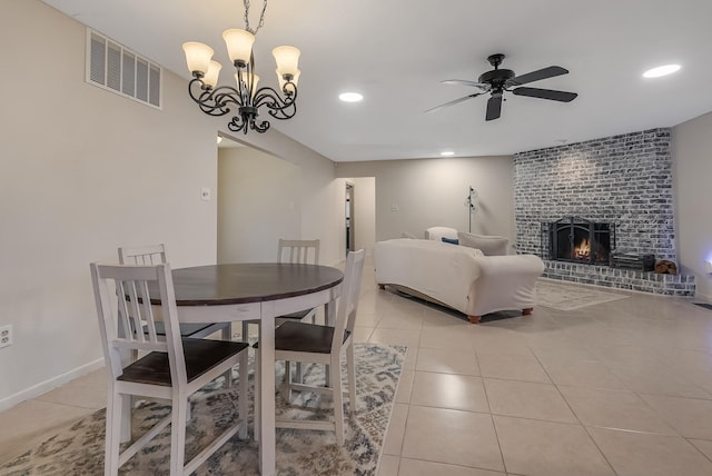 interior space featuring a notable chandelier, light tile patterned floors, and a fireplace