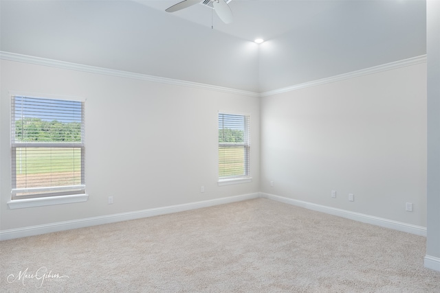 unfurnished room with ceiling fan, lofted ceiling, carpet flooring, and ornamental molding