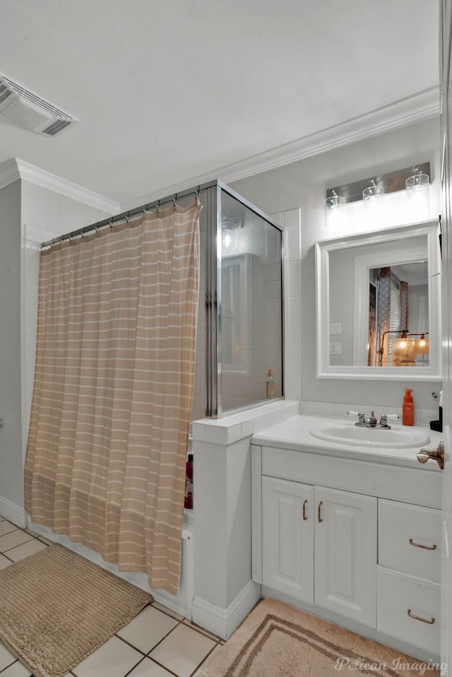 bathroom featuring tile patterned floors, vanity, and ornamental molding