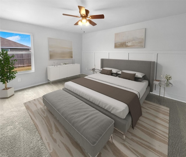 bedroom with ceiling fan and light colored carpet