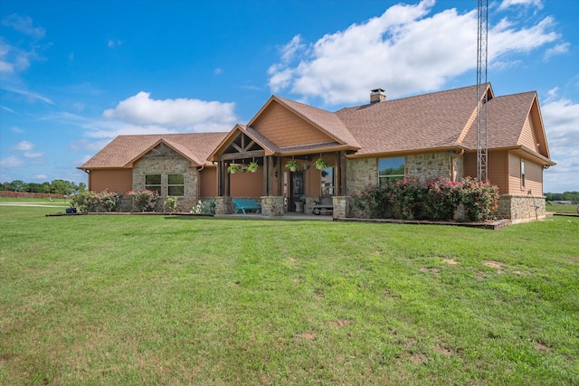 craftsman-style home featuring a front yard