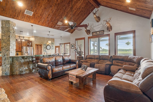 living room with dark hardwood / wood-style floors, ceiling fan, beam ceiling, high vaulted ceiling, and sink