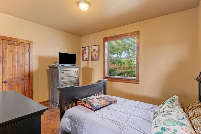 bedroom featuring dark hardwood / wood-style floors