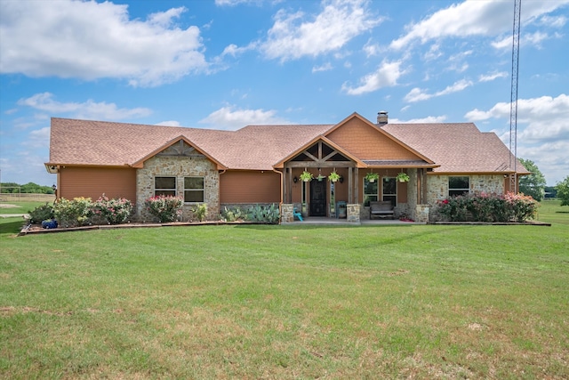 craftsman house with a front lawn