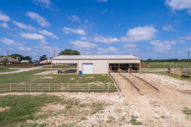 view of front facade featuring a rural view and an outbuilding