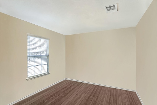 unfurnished room with hardwood / wood-style floors