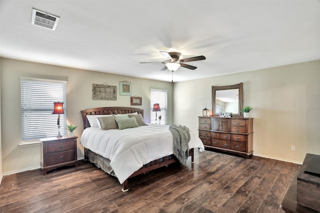 bedroom with ceiling fan and dark hardwood / wood-style flooring