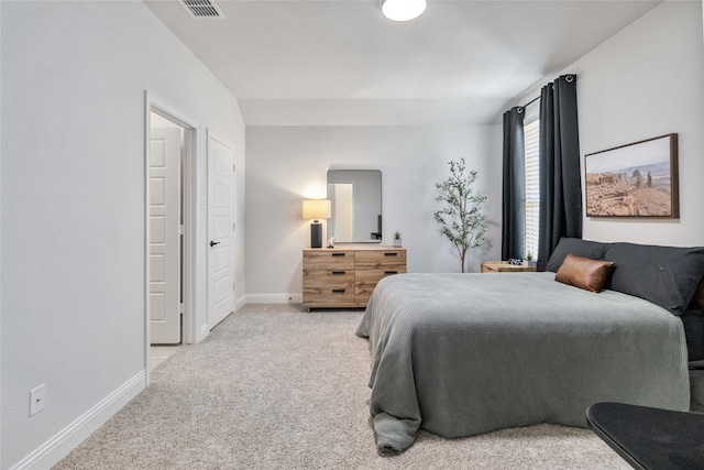 bedroom with light carpet