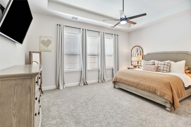 bedroom with ceiling fan and light carpet