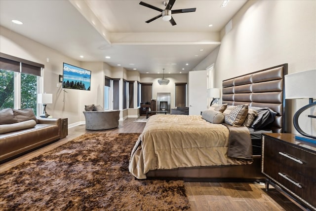 bedroom with hardwood / wood-style flooring and ceiling fan