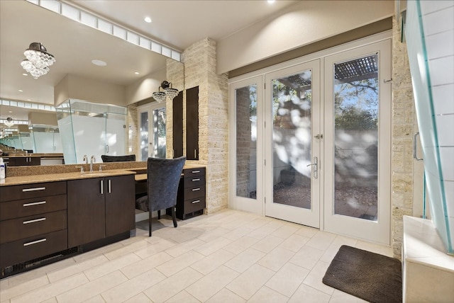 bathroom with vanity, french doors, and tile patterned floors