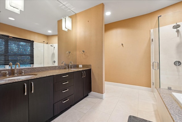 bathroom with vanity, plus walk in shower, and tile patterned flooring