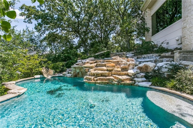 view of pool featuring pool water feature