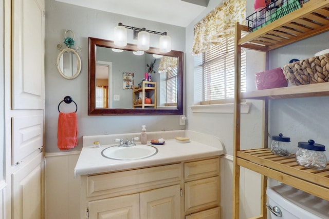 bathroom with vanity and toilet