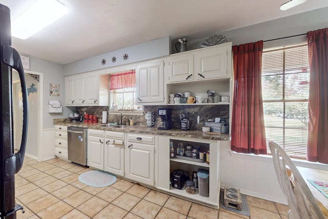 kitchen featuring white cabinetry, sink, black fridge, and dishwasher