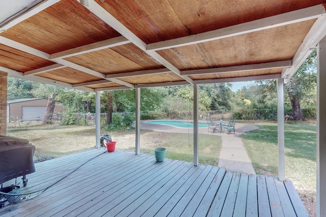 wooden terrace featuring a yard and grilling area