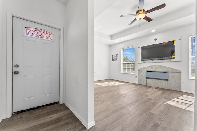 entryway with hardwood / wood-style floors and ceiling fan