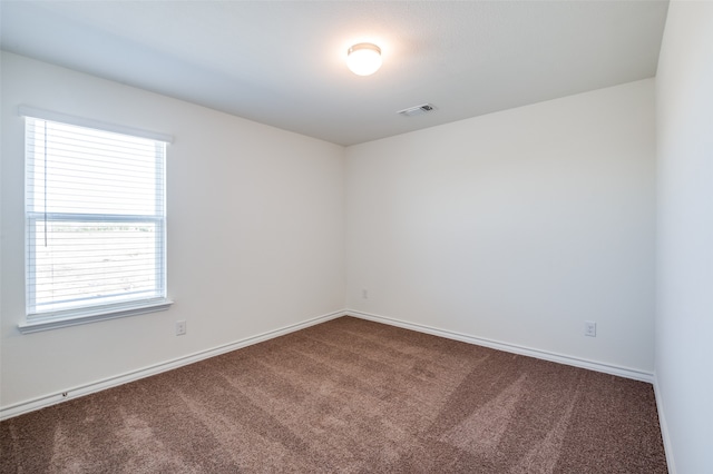 unfurnished room with carpet floors