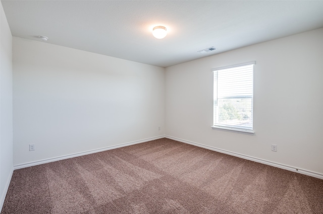 unfurnished room featuring carpet