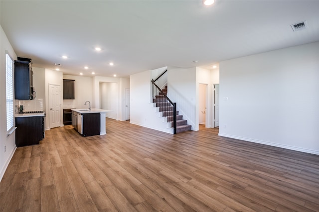 unfurnished living room featuring hardwood / wood-style floors