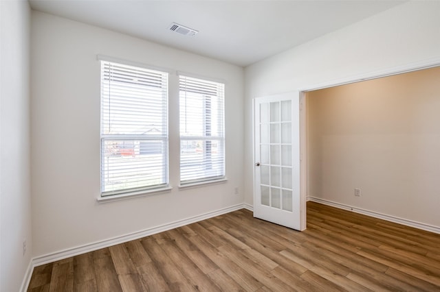 unfurnished room featuring light wood-type flooring