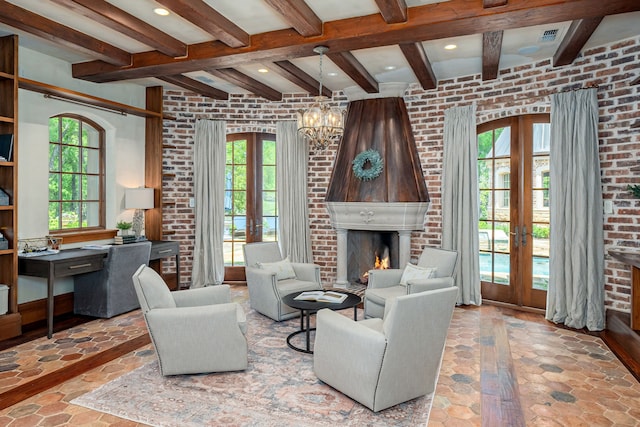 living room featuring french doors, a healthy amount of sunlight, and a fireplace