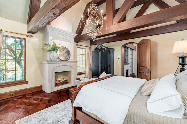 bedroom with a large fireplace, dark parquet flooring, high vaulted ceiling, and multiple windows