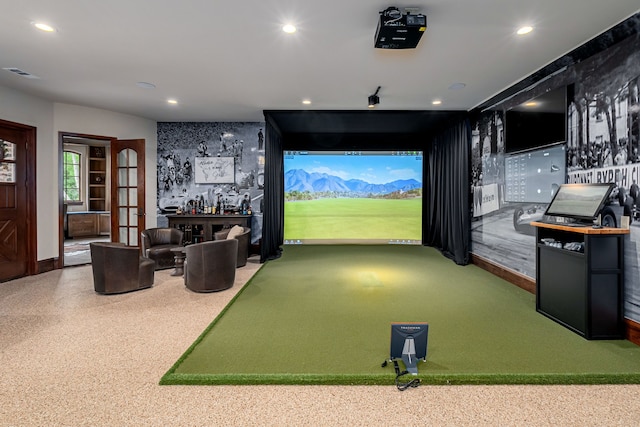 game room with golf simulator