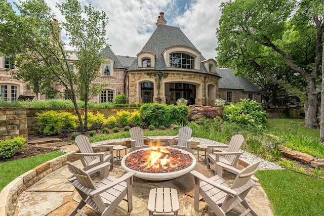 view of patio / terrace with an outdoor fire pit