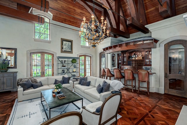 living room featuring french doors, dark parquet flooring, high vaulted ceiling, and plenty of natural light