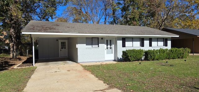 ranch-style home with a carport and a front yard