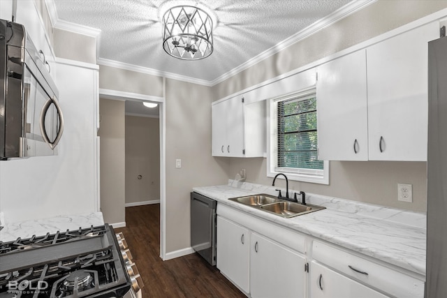 kitchen with sink, dark hardwood / wood-style floors, a textured ceiling, white cabinets, and appliances with stainless steel finishes