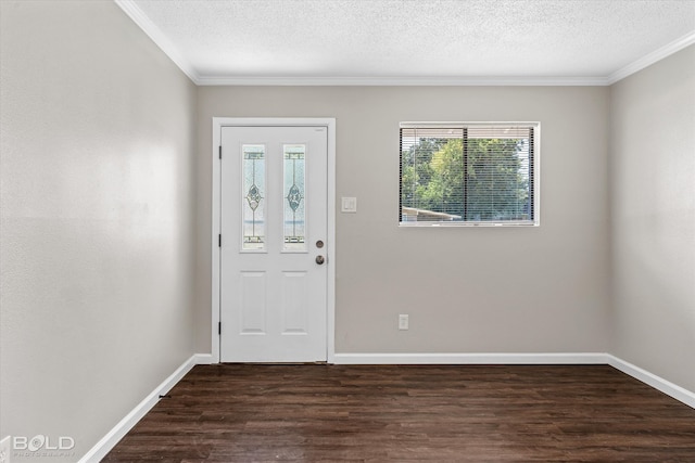 foyer entrance featuring dark hardwood / wood-style floors, ornamental molding, and a textured ceiling