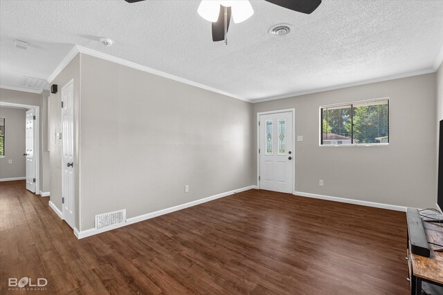 unfurnished room with a textured ceiling and dark wood-type flooring