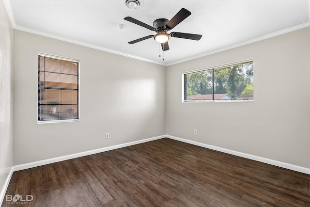 empty room featuring dark hardwood / wood-style floors, ceiling fan, and ornamental molding