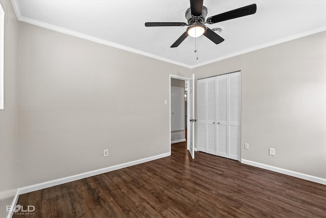 unfurnished bedroom with a closet, dark hardwood / wood-style floors, ceiling fan, and ornamental molding