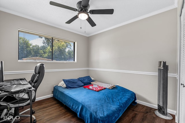 bedroom with a textured ceiling, crown molding, ceiling fan, and dark wood-type flooring