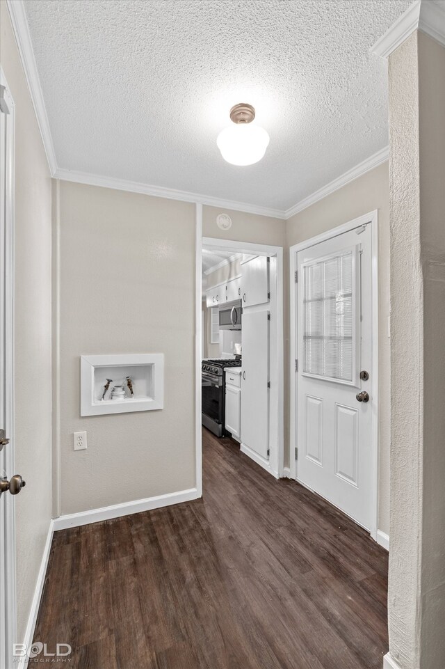 entrance foyer with crown molding, dark wood-type flooring, and a textured ceiling