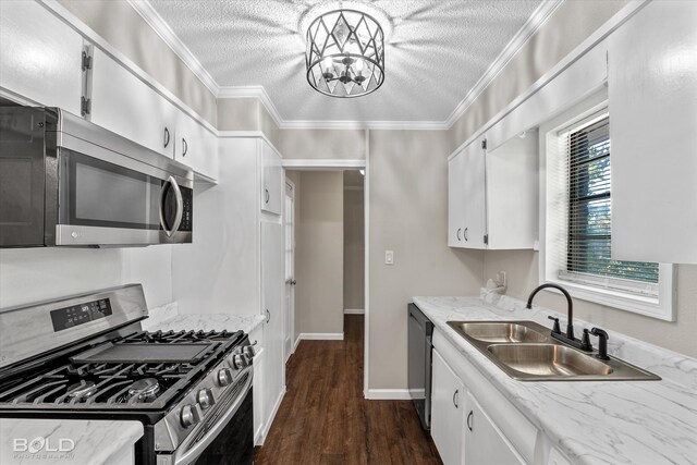 kitchen with white cabinets, sink, stainless steel appliances, and a textured ceiling