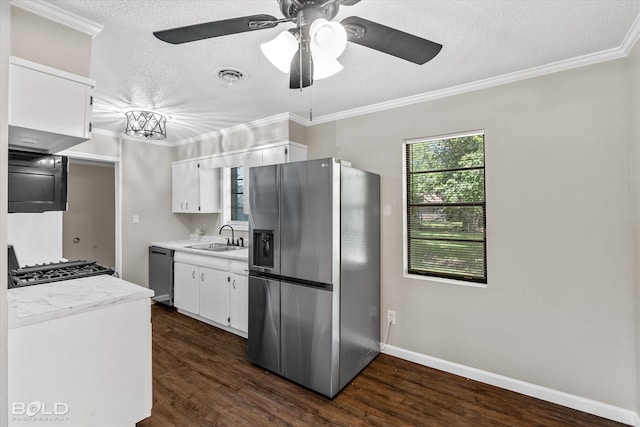 kitchen featuring sink, dark hardwood / wood-style floors, a textured ceiling, white cabinets, and appliances with stainless steel finishes