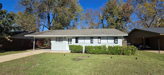 ranch-style home with a front yard and a carport