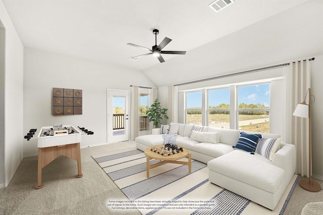 living room with light carpet, vaulted ceiling, and ceiling fan